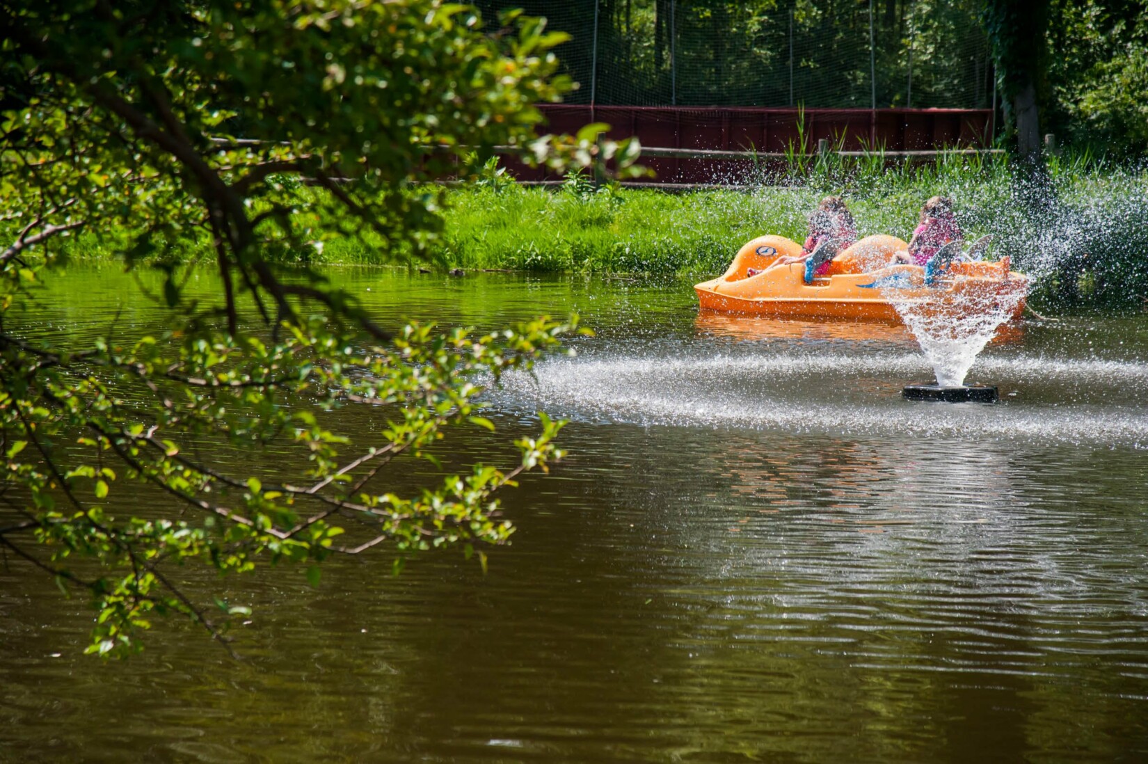 Campers on a paddle boat.
