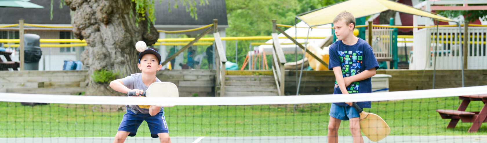 Campers playing pickleball.